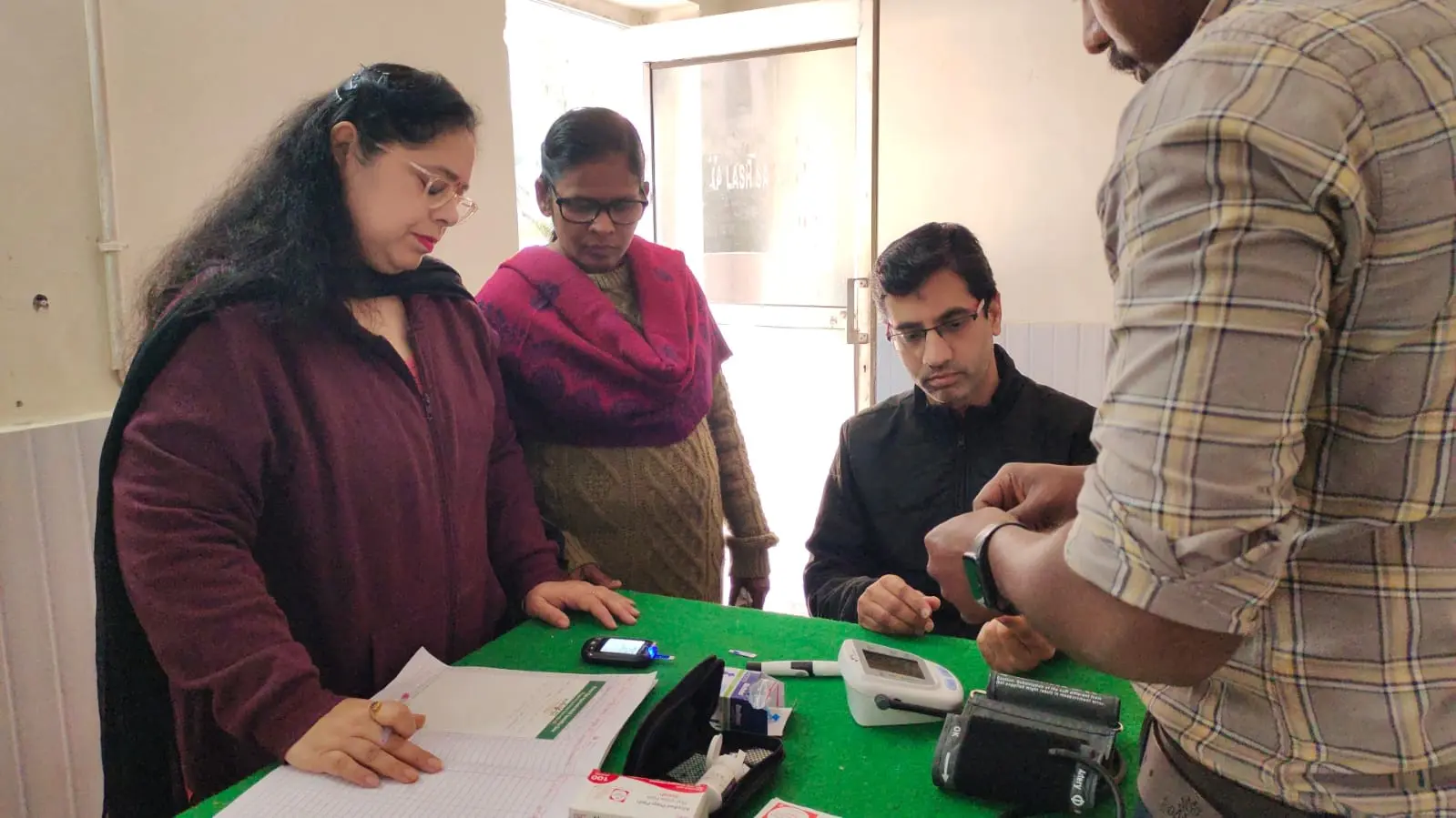 Community health screening and registration at the Purna Ojas camp